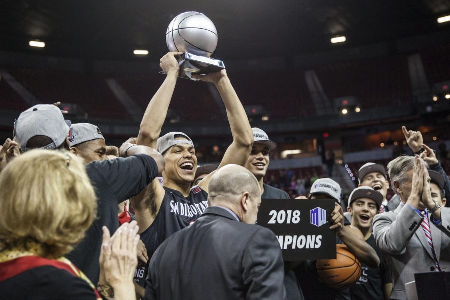 Trey Kell holds up the Mountain West Tournament MVP trophy after the Aztecs defeated New Mexico 82-75 at the Thomas & Mack Center on March 10.