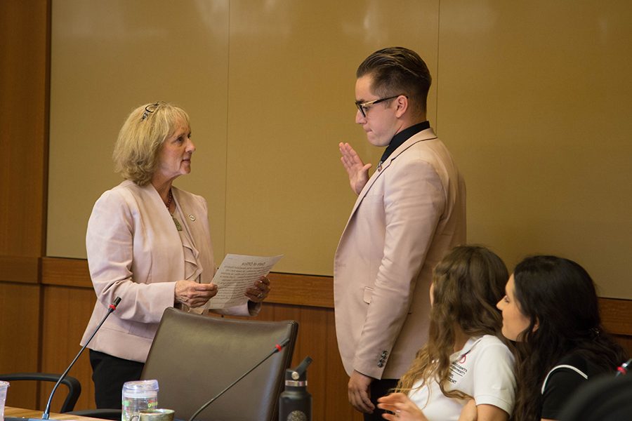 San Diego State President Sally Roush administers the oath of office to incoming Associated Students President Chris Thomas.