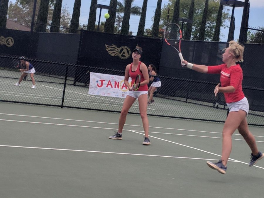 Sophomore Mia Smith (right front) and junior Jenny Moinard compete in doubles during the Aztecs 4-3 loss to San Jose State at the Aztec Tennis Center on April 21.