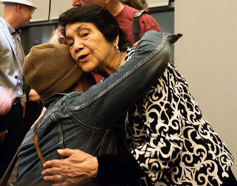 Labor activist Dolores Huerta embraces an attendee at her talk on UC San Diego’s campus.
