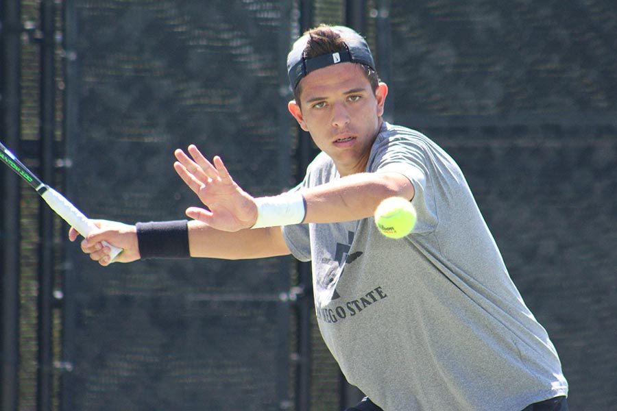 Sophomore Rafael Gonzalez Almazan prepares to swing his racket during the Aztecs 4-3 victory over Nevada at the Aztec Tennis Center on April 13. 