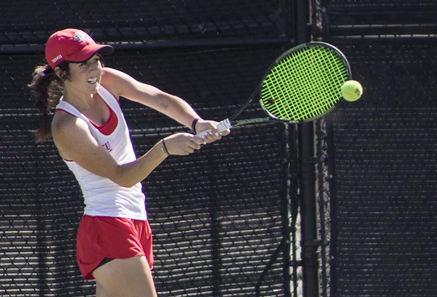 Freshman+Abbie+Mulbarger+swings+her+racket+during+the+Aztecs+4-1+victory+over+San+Francisco+at+Aztec+Tennis+Center+on+April+8.