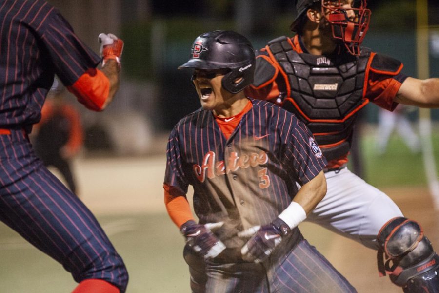 Sophomore second baseman Jacob Maekawa celebrates after scoring the game-winning run during the Aztecs 4-3 victory over UNLV on May 25 at Tony Gwynn Stadium.