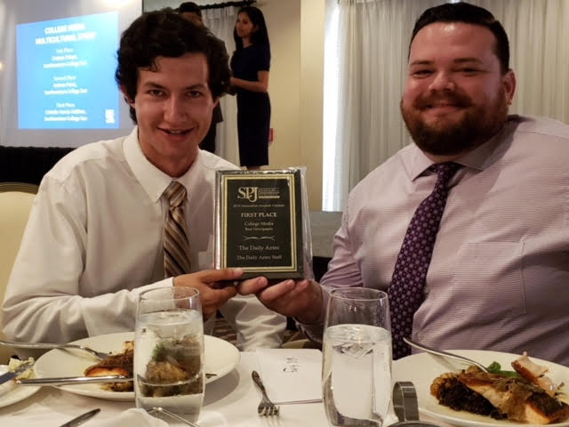 2017-18 Editor in Chief Andrew Dyer (right) and 2018-19 Editor in Chief Will Fritz (left) hold up The Daily Aztecs award for Best College Newspaper. Photo courtesy of Dr. Bey-Ling Sha, director of SDSUs School of Journalism and Media Studies.