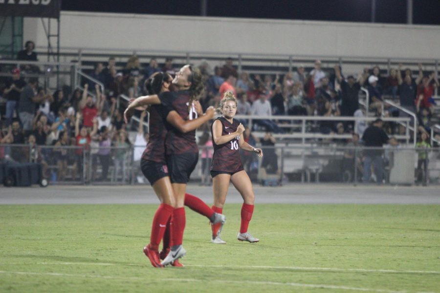 Freshman forward Taylor Moorehead (left) celebrates with sophomore midfielder Daniela Filipovic (middle) as senior midfielder Nikolina Musto (right) looks on after Moorehead scored the game winning goal during the Aztecs 1-0 victory over New Mexico State on Aug. 17 at the SDSU Sports Deck. 