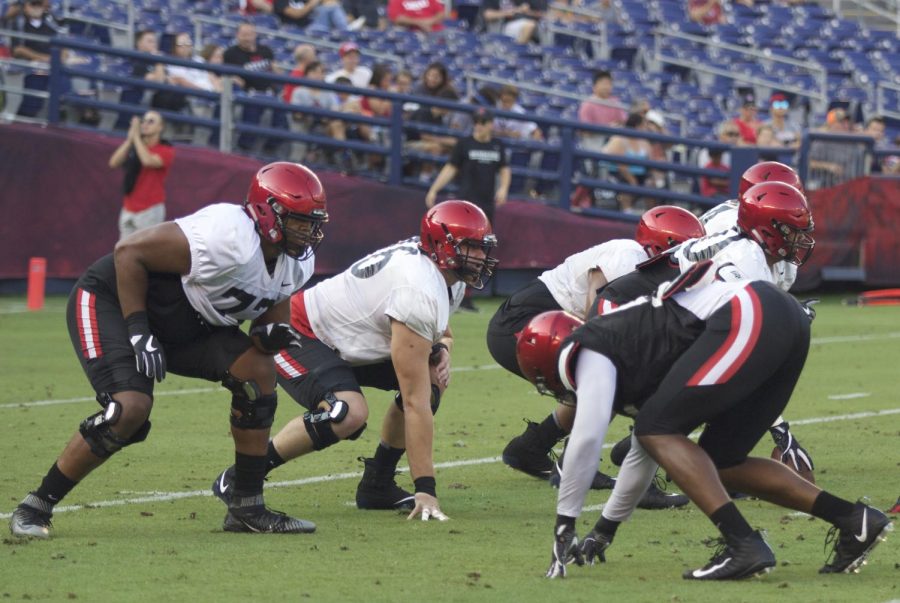 Offensive line scrimmages at the annual Fan Fest at SDCCU Stadium on Aug. 18.