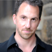 Associate professor Patrick Walders in a headshot for SDSU's music department's staff website. 