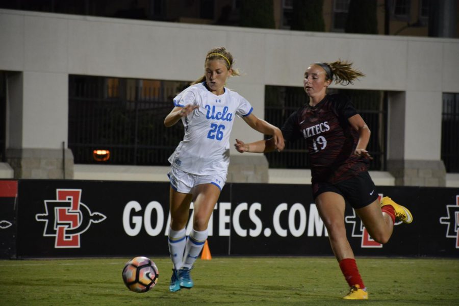 SDSU sophomore forward Mia Root (right) goes for the ball against UCLA redshirt sophomore midfielder Meghan Scudero (left) during the Aztecs 3-0 loss to the Bruins on Sept. 16 at the SDSU Sports Deck.