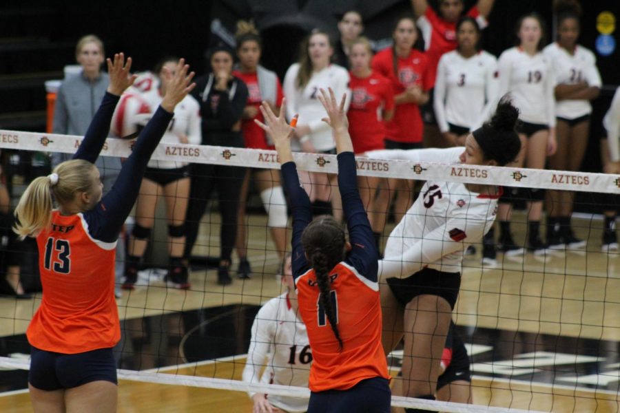 Senior+middle+blocker+Deja+Harris+follows+through+after+spiking+the+ball+during+the+Aztecs+five-set+loss+to+UTEP+on+Sept.+15+at+Peterson+Gym.+