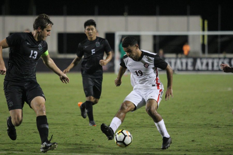 Senior forward Damian German dribbles the ball during the Aztecs 2-0 victory over Brown University on Sept. 14 at the SDSU Sports Deck. German had two goals in the game. 
