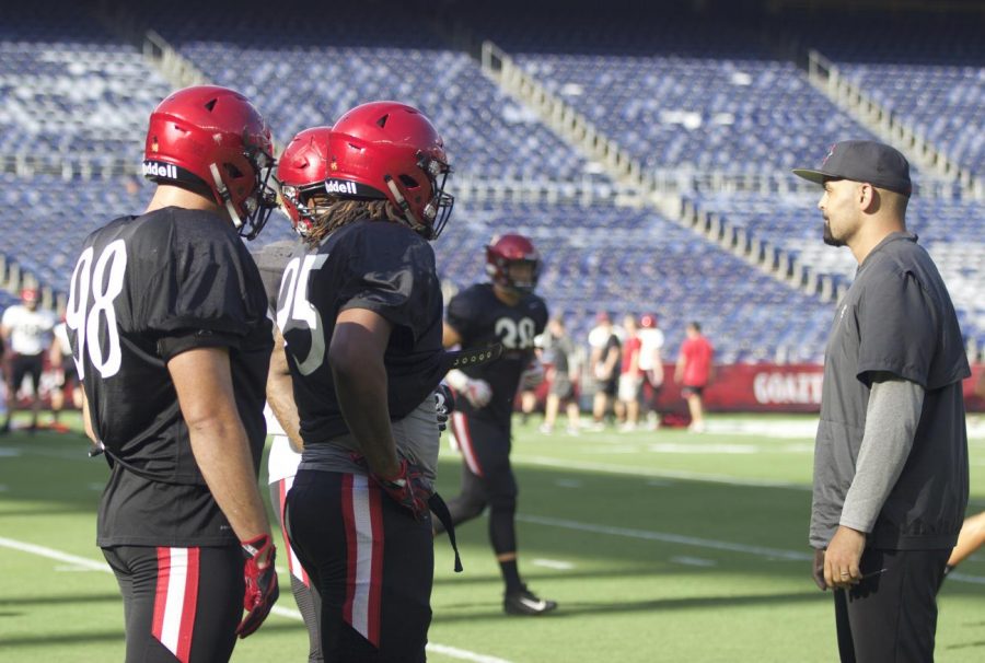 SDSU+senior+defensive+lineman+Damon+Moore+%28left%29%2C+senior+defensive+lineman+Noble+Hall+%28middle%29+and+defensive+line+coach+Ernie+Lawson+%28right%29+prepare+for+scrimmage+at+the+annual+Fan+Fest+on+Aug.+18+at+SDCCU+Stadium.