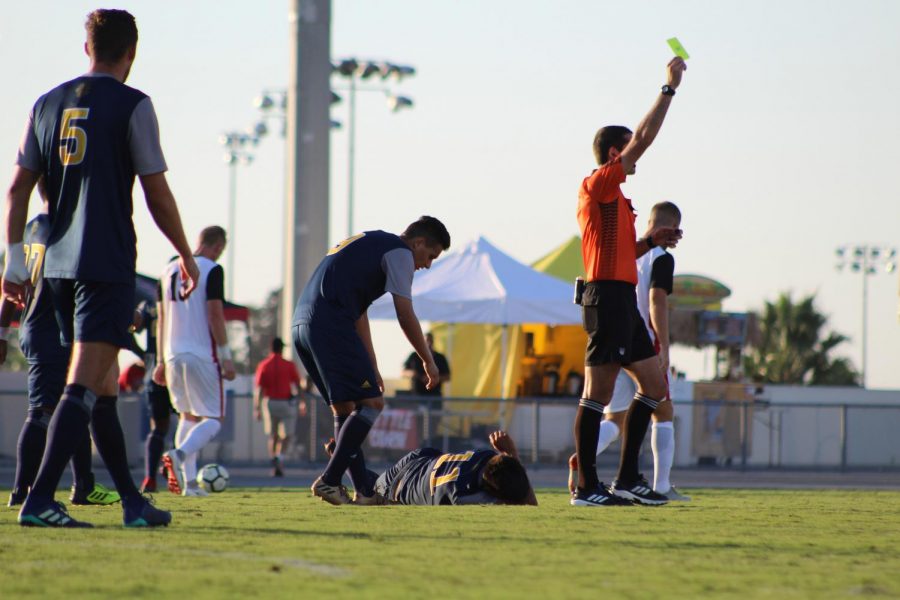 The referee shows SDSU a yellow card during the Aztecs 2-1 victory over UC Irvine on Sept. 9 at the SDSU Sports Deck.
