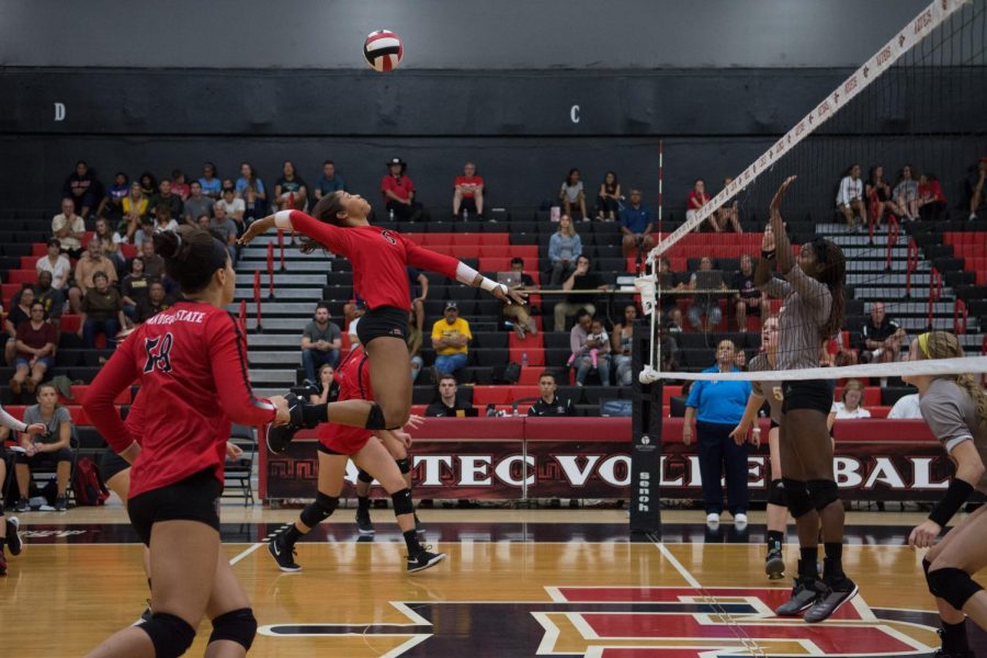 Junior outside hitter Ashlynn Dunbar goes up to spike the ball during the Aztecs five-set victory over Wyoming on Sept. 29 at Peterson Gym. Dunbar set a new career high in the match with 23 kills. 