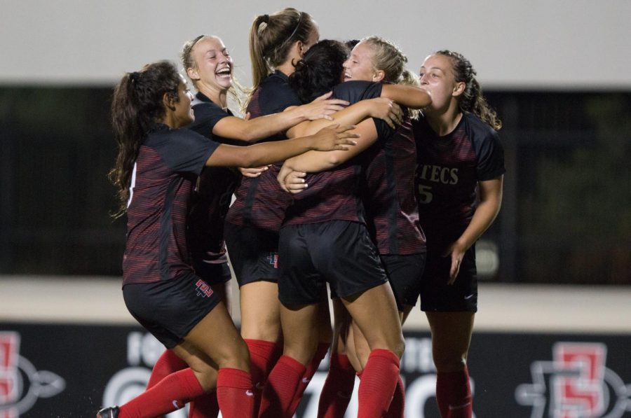 The Aztecs come together to celebrate after Yasmin Ahooja scored the go-ahead goal in the 73rd minute of SDSUs 2-1 victory over Wyoming on Sept. 21 at the SDSU Sports Deck.