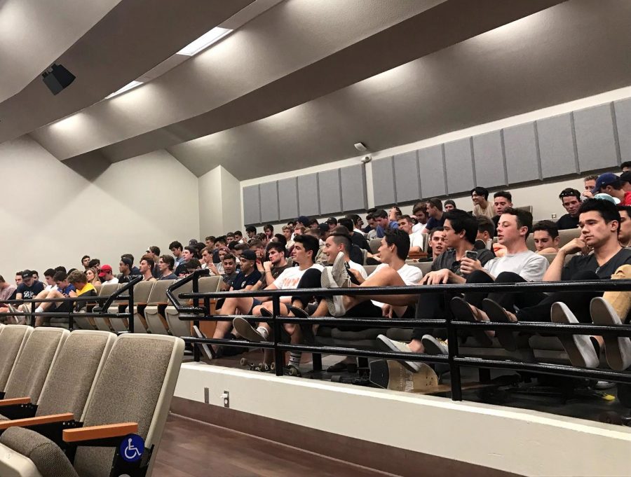 Fraternity members attend the lecture 