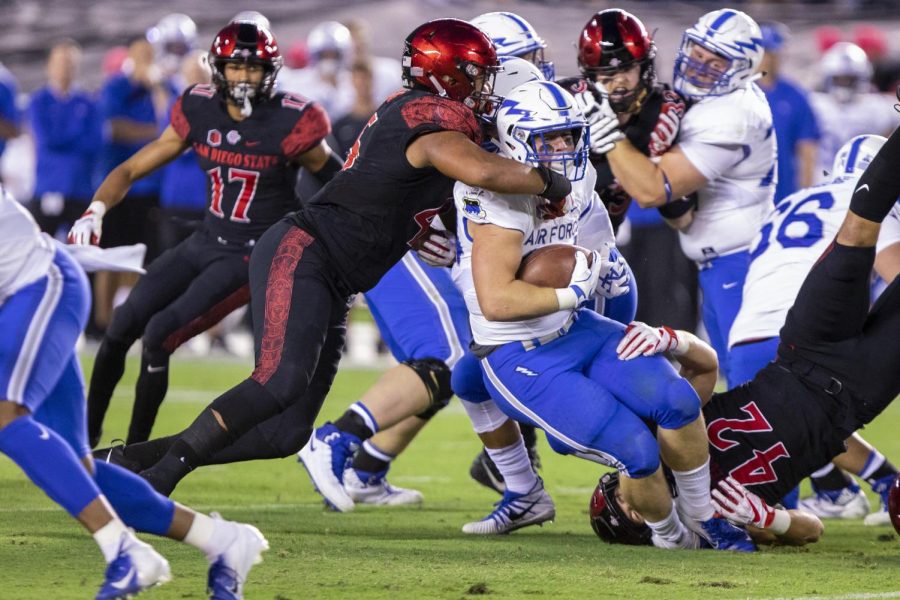 Senior defensive lineman Anthony Luke takes down an Air Force ball carrier on Oct. 12 at SDCCU Stadium.