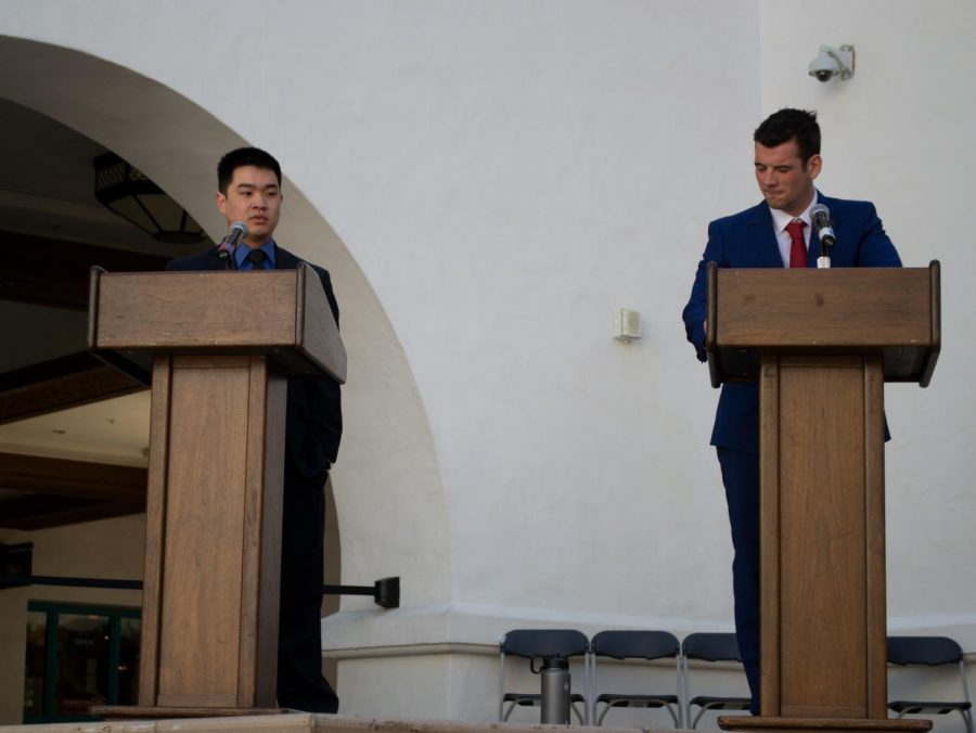 Vice President of University Affairs candidates Winston Liew (left) and George Scott square off in front of students at the Conrad Prebys Aztec Student Union on the afternoon of Monday, March 18.