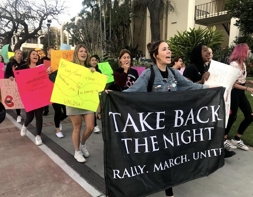Womyn%E2%80%99s+Outreach+Association+President+Shelby+Rodich+led+the+Take+Back+the+Night+march+on+campus.+