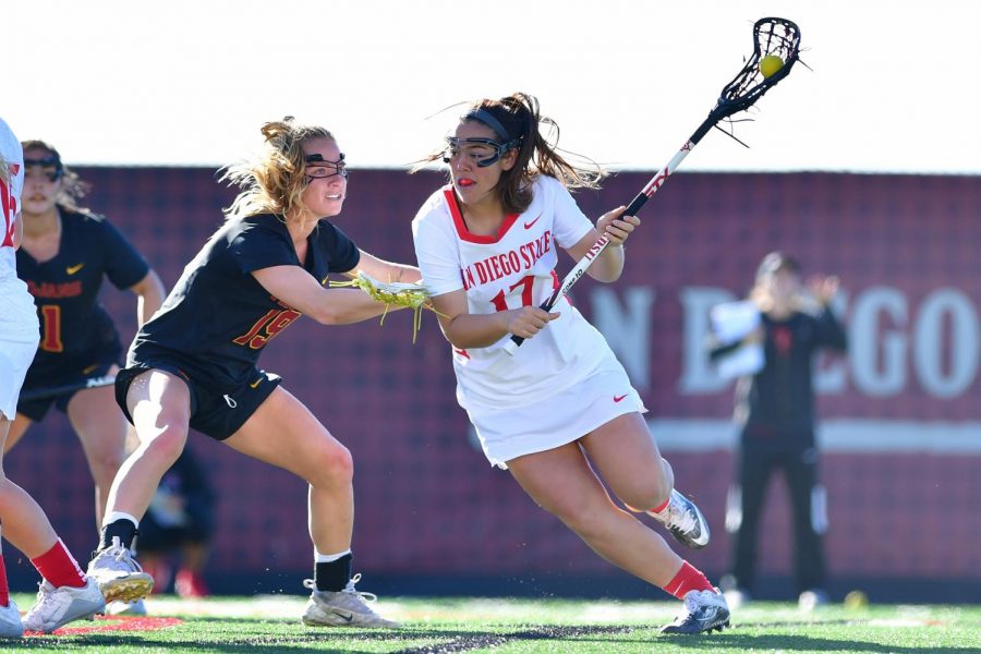 Senior midfielder Harlowe Steele takes on the USC defender during the Aztecs 20-16 loss to the Trojans on Feb. 22 at the Aztec Lacrosse Field.