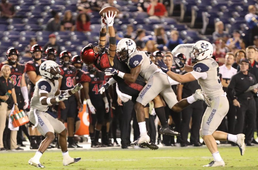 Then-redshirt freshman wide receiver Jesse Matthews catches a pass over Utah State then-sophomore cornerback Andre Grayson in the Aztecs' 23-17 loss to Utah State on Sept. 21, 2019 at SDCCU Stadium.