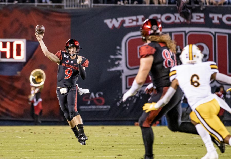 Senior quarterback Ryan Agnew throws on the run during the Aztecs 26-22 victory over Wyoming on Oct. 12 at SDCCU Stadium. Agnew finished the game with 209 yards and two touchdowns on 21 of 32 passing.