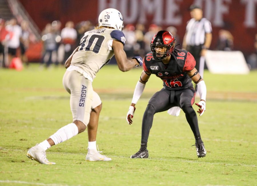 Senior cornerback Luq Barcoo drops back in coverage against Utah State senior wide receiver Siaosi Mariner during the Aztecs 23-17 loss to the Aggies on Sept. 21 at SDCCU Stadium.