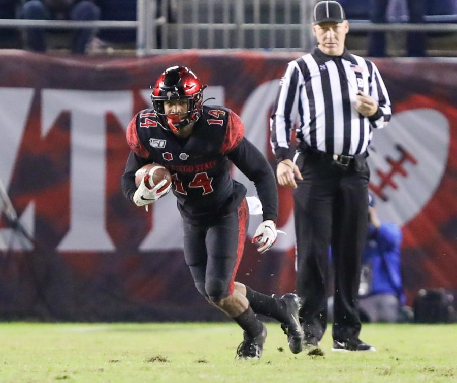 Aztecs junior safety Tariq Thompson picks off BYU sophomore quarterback Zach Wilson during SDSUs 13-3 victory on Nov. 30 at SDCCU Stadium.