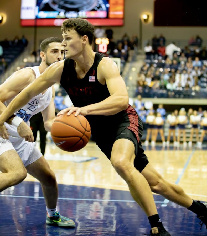 Graduate senior forward Yanni Wetzell drives to the basket in the Aztecs 66-49 win over the University of San Diego on Nov. 20 at Jenny Craig Pavilion. Wetzell finished the game with a career-high 20 points and 12 rebounds.