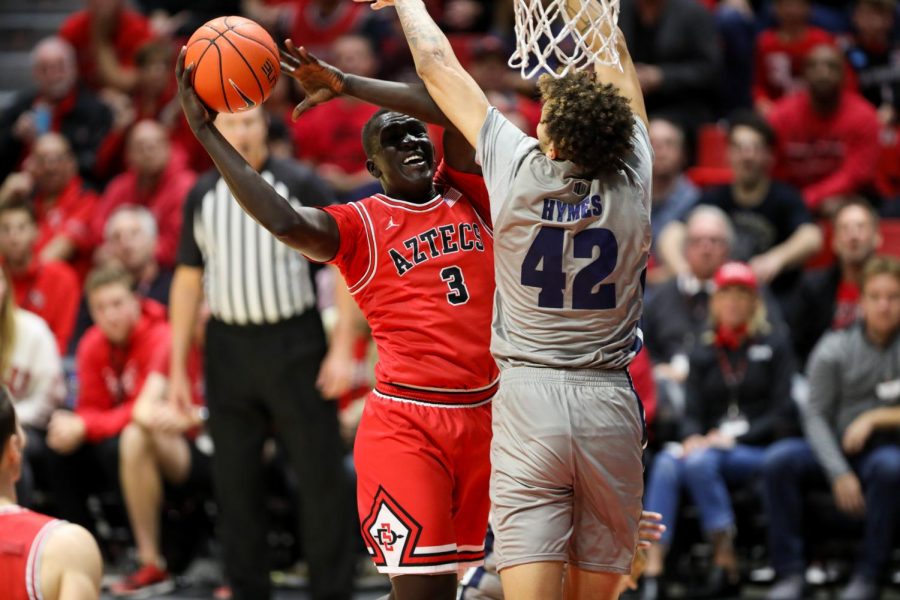 Sophomore forward Aguek Arop tries to go up to the rim.