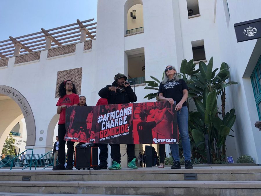Students and faculty representing the Africans Charge Genocide group protest the potential ban on two guest speakers accused of anti-Semitism.
