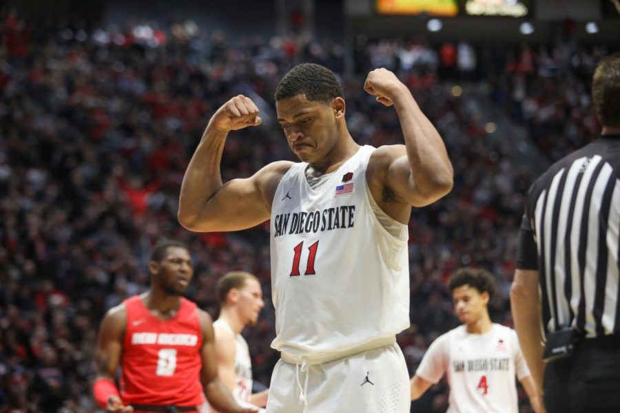 Junior forward Matt Mitchell flexes in celebration after a chance to complete a three-point play against New Mexico on Feb. 11 at Viejas Arena.
