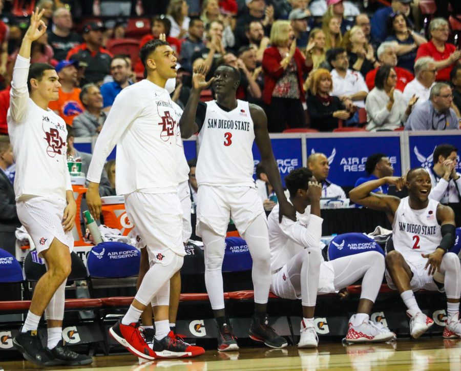 The Aztec bench celebrates during its 73-60 win over Air Force in the Mountain West tournament quartfinal at the Thomas and Mack Center on March 5.