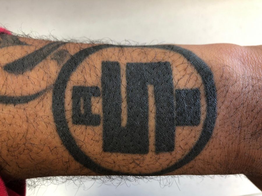 Another one of Edens tattoos on his left arm in honor of Nipsey Hussles record label All Money In.