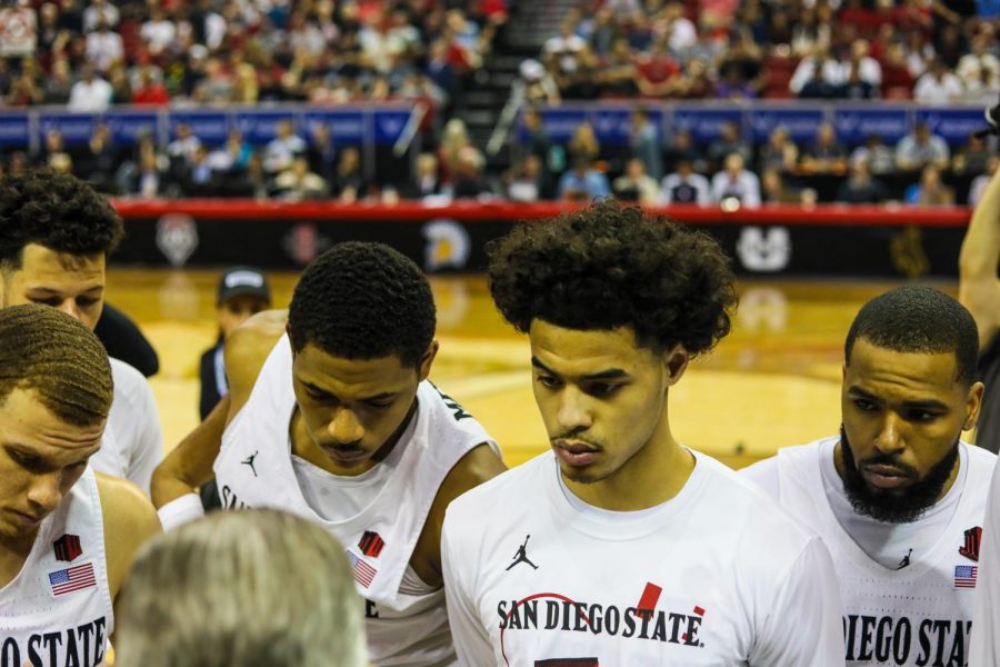 SDSU players huddle up before tip-off against Utah State at Thomas and Mack Center on March 7.