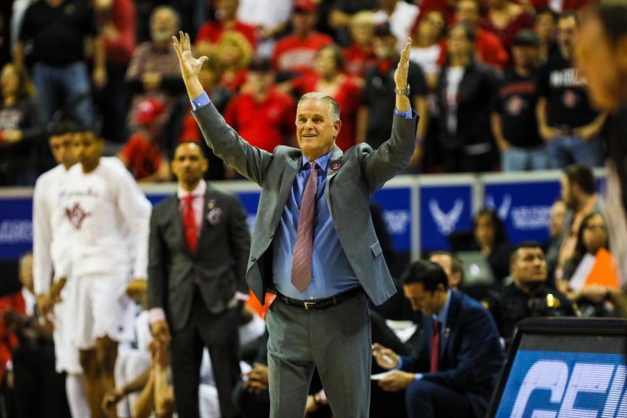 Head coach Brian Dutcher throws his hands up during the Aztecs’ 59-56 loss against Utah State at Thomas and Mack Center on March 7.