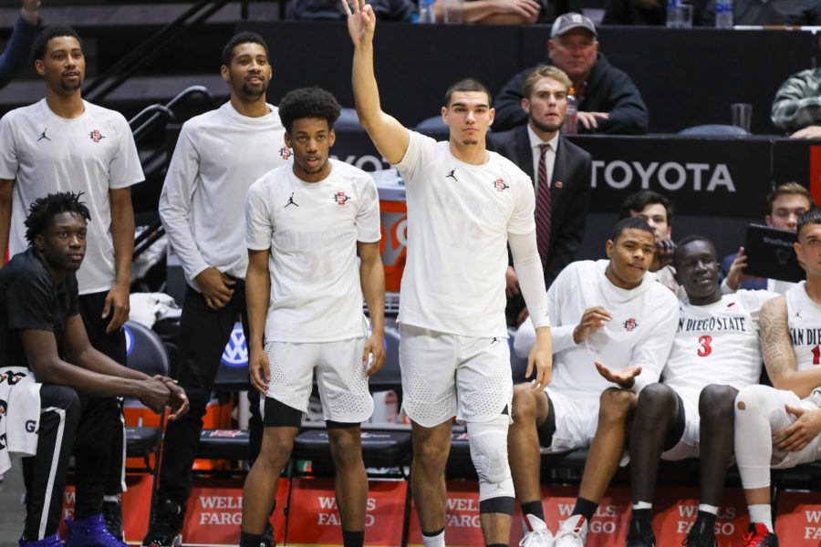 Aztec players react awaiting the result of a play during its historic 2019-20 season that way cut short due to coronavirus.