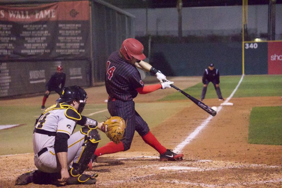 Senior outfielder Mike Jarvis connects on a pitch during the Aztecs 4-1 win over Iowa on Feb. 21 at Tony Gwynn Stadium.