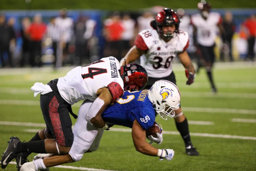 Fans will have to wait a few weeks longer to watch the San Diego State football team. That includes senior defensive back Tariq Thompson (pictured tackling a San José State player during the Aztecs 27-17 win over the Spartans on October 19, 2019 in San José, California). Thompson received a preseason honor from the Mountain West Conference after he was named first team All-MW Defense.