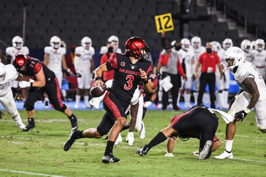 Sophomore+quarterback+Carson+Baker+scrambles+away+from+UNLV+defenders+during+the+Aztecs+34-6+win+over+the+Runnin+Rebels+on+Oct.+24+at+Dignity+Health+Sports+Park+in+Carson%2C+Calif.