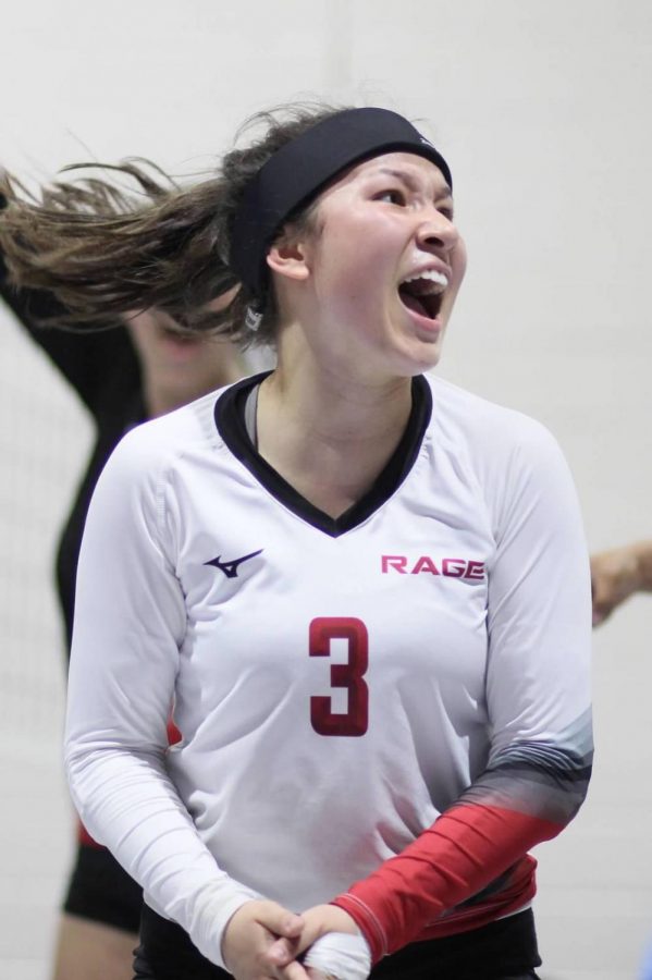Defensive specialist and libero Nadia Barcklay celebrates after a play while playing club volleyball.
