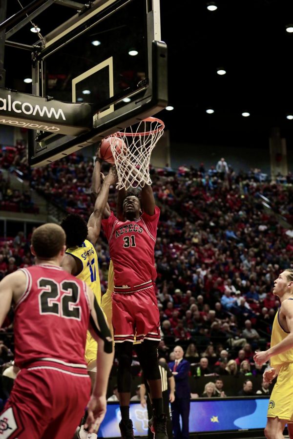Then-sophomore forward  Nathan Mensah goes up to the basket during the Aztecs 59-57 victory over San José State on Dec. 8, 2019 at Viejas Arena.