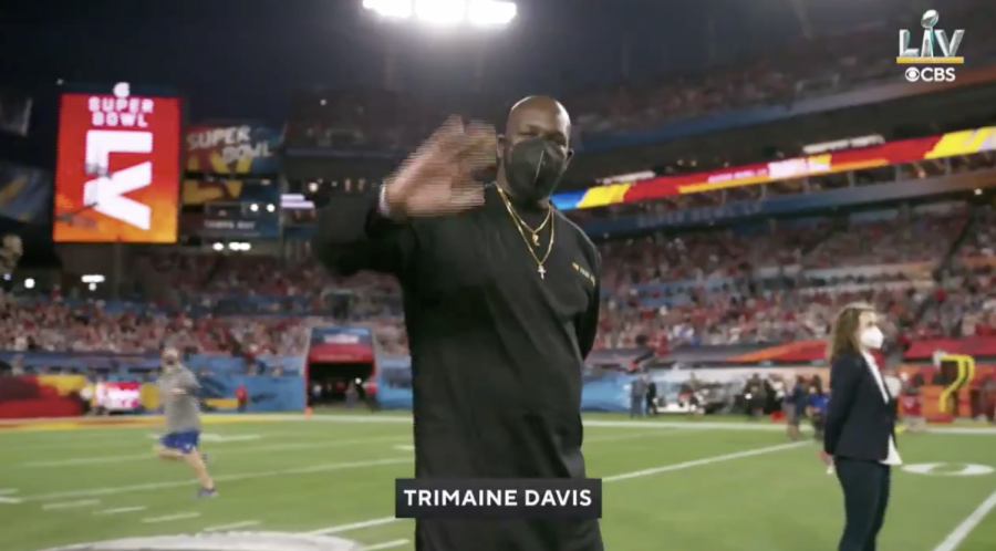 Trimaine Davis, an honorary captain during Super Bowl LV, waves to the camera while being honored during a pregame ceremony at Raymond James Stadium in Tampa Bay, Fla. on Feb. 7, 2021.