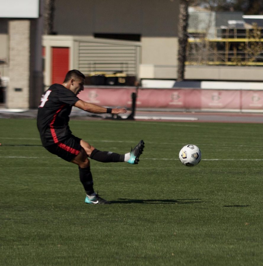 San Diego State mens soccer junior midfielder Tristan Weber scores off a free-kick to give San Diego State a 1-0 lead in the 24th minute. The Aztecs defeated No. 4 Washington 2-0 on March 28, 2021 at the SDSU Sports Deck.