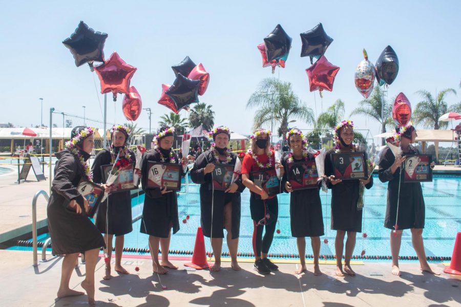 Eight+seniors+from+the+San+Diego+State+water+polo+team+pose+for+a+photo+during+Senior+Day+festivities+and+before+the+Aztecs+16-9+win+over+Cal+Baptist+on+April+17%2C+2021+at+the+SDSU+Aquaplex.