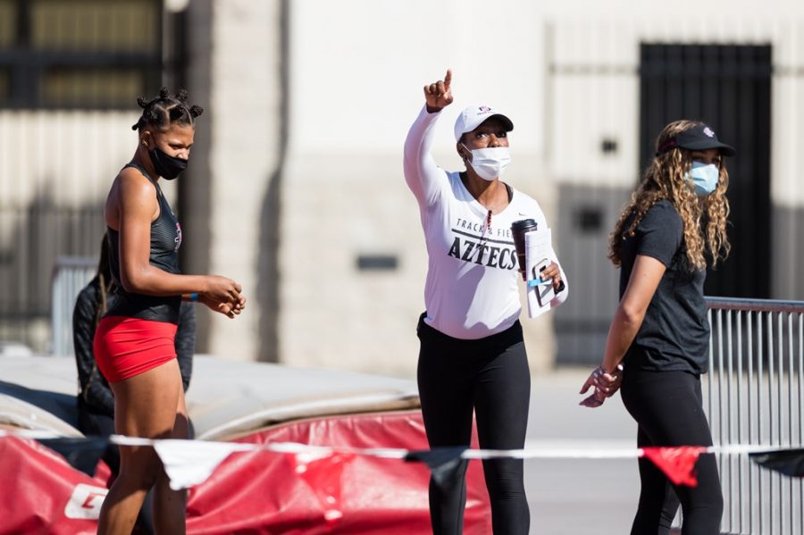 San Diego State track and field head coach Shelia Burrell (middle) gives out instructions during the Aztecs second-place finish at the Aztec Invitational in a dual meet versus Utah on  Feb. 25, 2021 at the Aztrack Sports Deck.