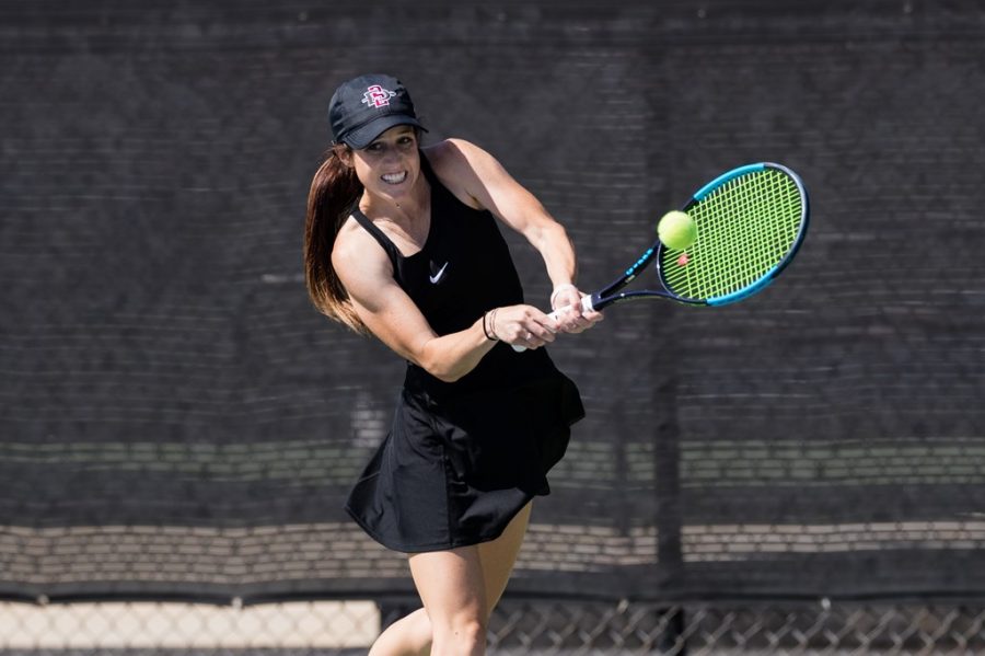San Diego State womens tennis senior Abbie Mulbarger connects with the ball during the Aztecs 7-0 loss to Oregon on March 22, 2021 at the SDSU Tennis Center.