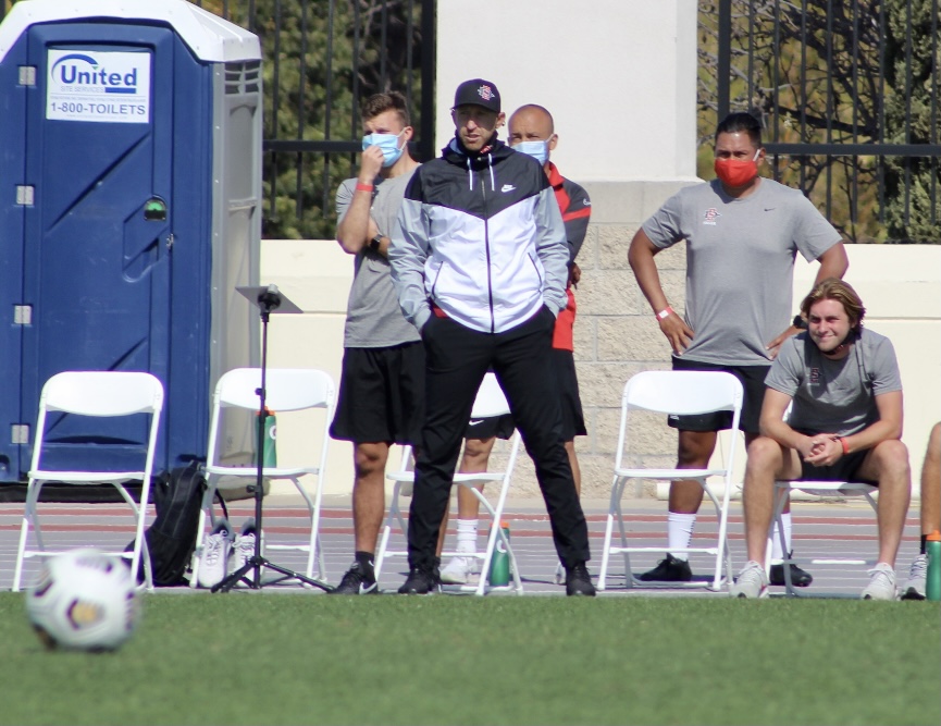 San Diego State men's soccer head coach Ryan Hopkins and his staff look on during the Aztecs' 4-0 loss to Oregon State on April 17, 2021 at the SDSU Sports Deck.