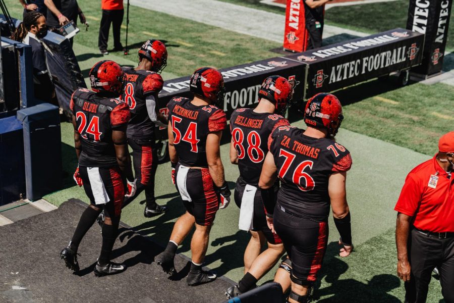 San Diego State football captains walk out before the game for the coin toss.