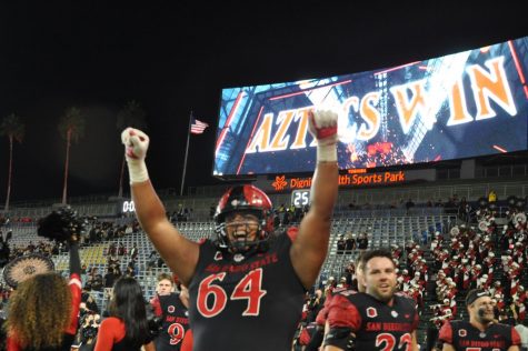 Senior lineman Chris Martinez revels in the moment after the triple overtime victory versus Utah. The Aztecs have defeated both of their Pac-12 opponents in 2021.