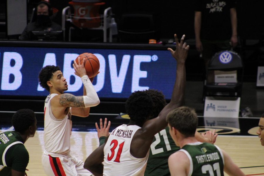 Trey Pulliam (left) goes up for a shot against Colorado State.